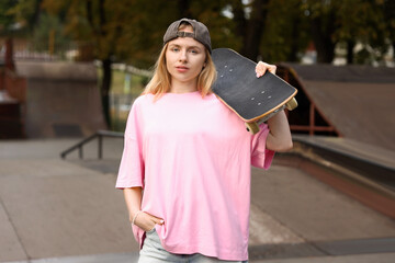 Stylish woman with skateboard in skate park © New Africa