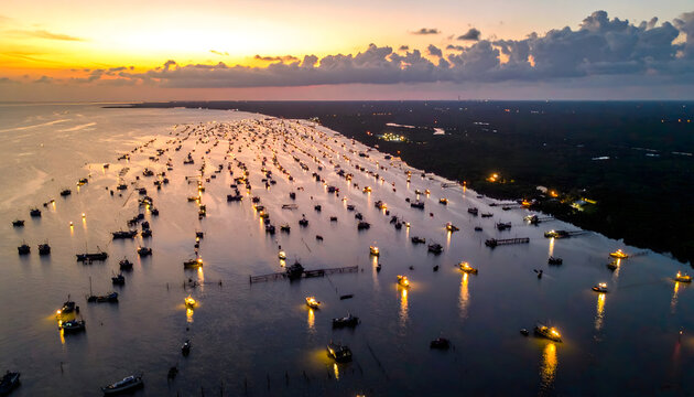 Aerial view of oyster farming cages glowing at sunset in Kien Giang province, Vietnam