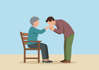 Fototapeta premium Son kissing hand of his elderly mother sitting on a chair as a sign of respect and love