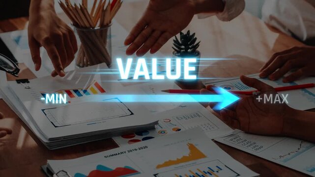 A dynamic business meeting showcases teamwork as hands point towards documents and graphs, emphasizing value creation and strategic growth in a modern office environment. Raster