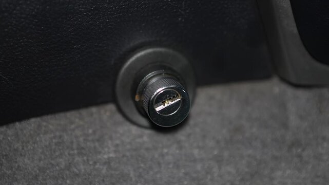 Car mechanical gear shift lock cylinder (like Bear-Lock or Construct) installed in the center console side panel to protect against vehicle theft.
