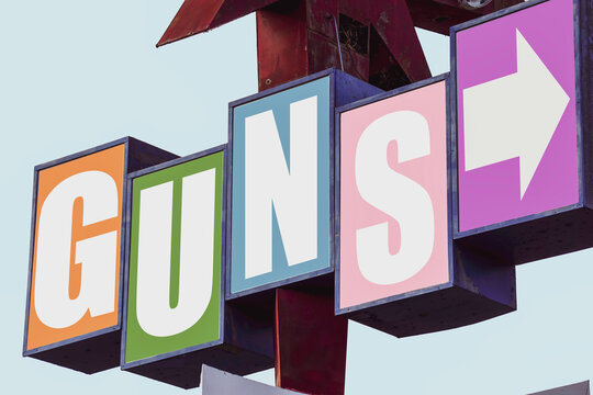 Colorful guns sign with arrow