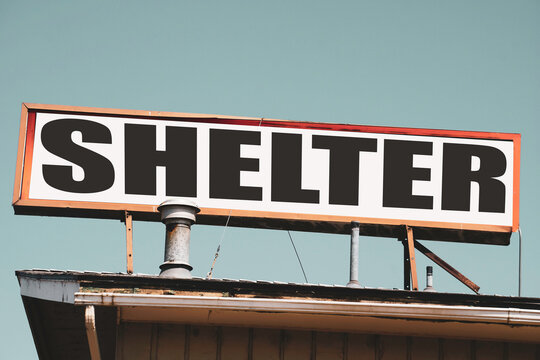 Shelter sign on top of building
