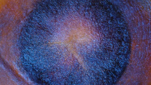 Mixing alcohol ink in a circular pattern with various colors and textures