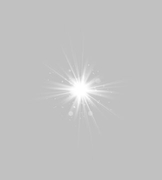 A bright white starburst radiates from the center with sharp, elongated rays extending outward. The light displays a gradient of soft glow and scattered small glowing particles.