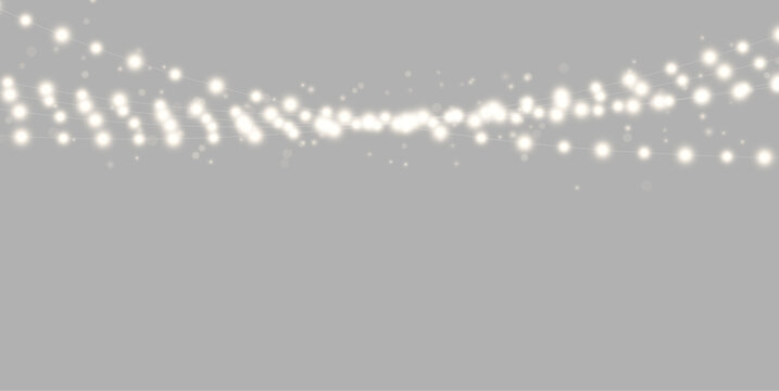 A row of warm white string lights glows softly against a black background. The lights are arranged horizontally with slight curves and a gentle diffusion around each bulb.