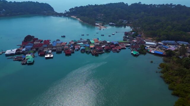Traditional floating fishing village on stilts bay. Perfect aerial view drone