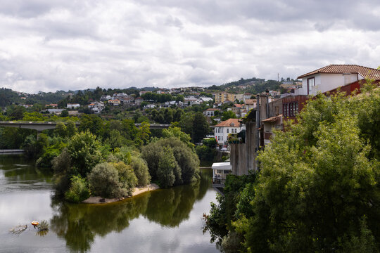 panoramic view of the town of Amarante, Portugal on the banks of the T&acirc;mega River with reflections