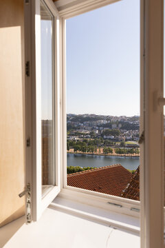 view of river and town from a boutique hotel, home window in Europe