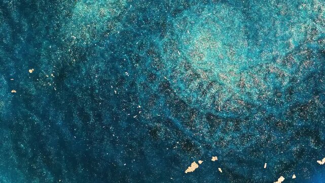 Mixing alcohol ink creates abstract patterns in vibrant colors
