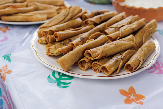 flautas de pollo or chicken fried tacos in Mexico Latin America, Mexican feast with Homemade food on table