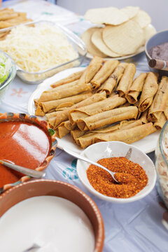flautas de pollo or chicken fried tacos in Mexico Latin America, Mexican feast with Homemade food on table