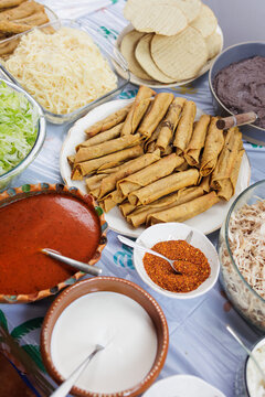 flautas de pollo or chicken fried tacos in Mexico Latin America, Mexican feast with Homemade food on table
