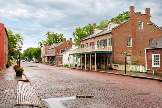 The brick paved South Main Street featuring 18th century and early 19th century buildings in the historic district of St Charles, Missouri, USA.
