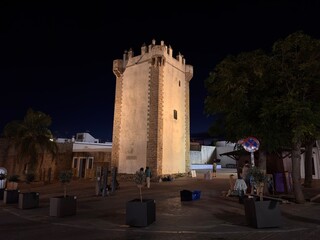 Illuminated Torre de Guzman at night, Plaza de Santa Catalina, nightlife in Conil de la Frontera, Costa de la Luz, Andalusia, Spain © keBu.Medien