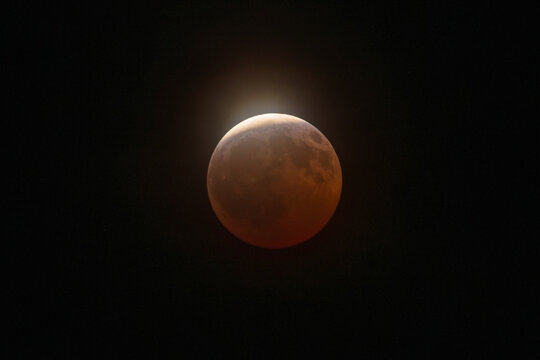 Partial lunar eclipse with atmospheric sky