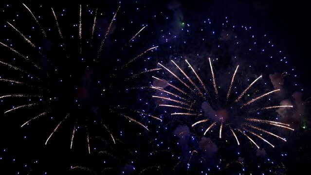 twilight fireworks with colorful smoke trails, dazzling night display featuring glowing sparks and gentle mist, spectacular evening fireworks illuminating sky with delicate hues and wispy smoke
