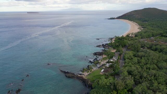 Aerial over Ahihi Bay, Makena Beach and Makena Cove in Kihei, on Maui in Hawaii. Puʻu Olai crater, west Maui visible and Molokini Crater visible in the distance. Spring morning, April, 2026.