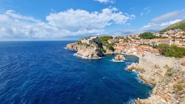The historic Fort Lovrijenac on a rocky cliff and the blue Adriatic Sea in old town of Dubrovnik, Croatia, on a sunny day