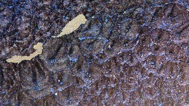 Mixing alcohol ink in macro view during crafting session indoors