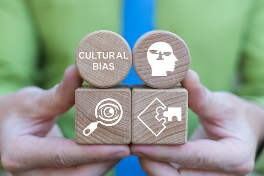 Cultural bias concept. Business person holding blocks with the inscription CULTURAL BIAS. Discrimination or diversity awareness.