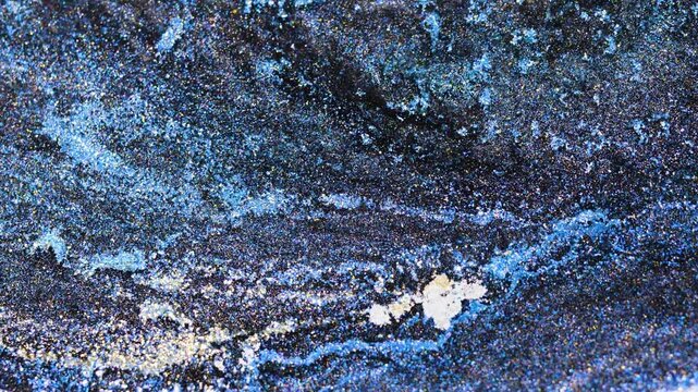Mixing alcohol ink to create colorful designs on a textured surface
