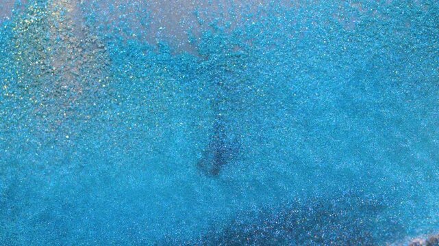 Mixing alcohol ink to create unique patterns on a dark surface