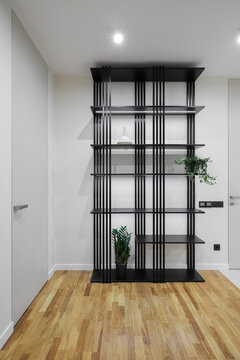 Black shelving unit in apartment