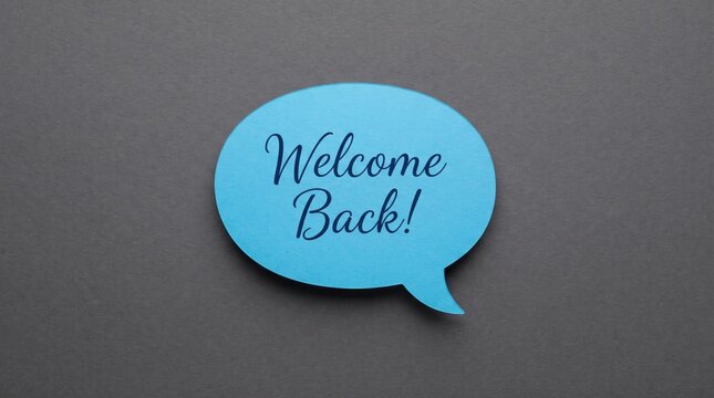 Blue speech bubble with the text welcome back on a dark background