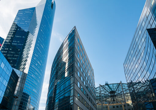PARIS, FRANCE - SEPTEMBER 1, 2026 - Modern glass facades reflecting sky in Paris financial hub