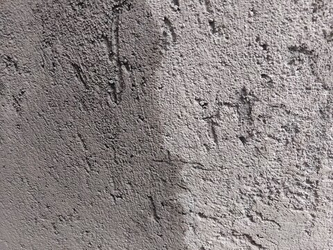 Rough concrete texture background with coarse cement wall surface full frame
