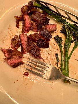 Pan Seared Steak with Sliced Broccolini on a Plate
