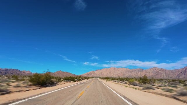 Mojave Desert POV Drive Toward Desert Mountains in California