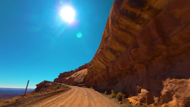 Moki Dugway POV Drive Beneath Sandstone Cliffs in Utah