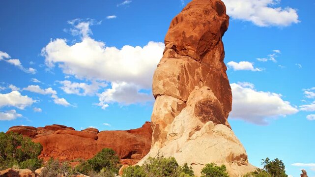 Golden sunset light glows over Double O Arch and the Devils Garden landscape in Arches National Park