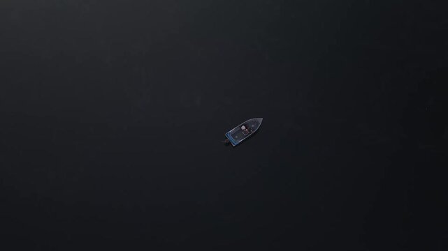 Drone 360 degree of a small fishing boat floating on the pond in Maine