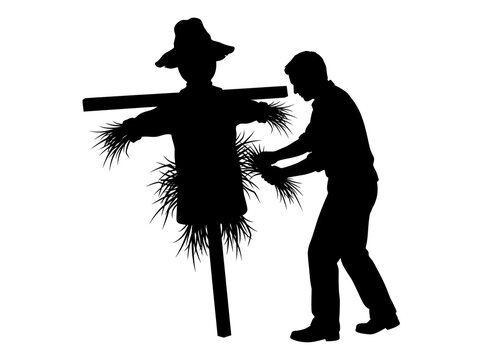 Scarecrow silhouette vector illustration isolated on a transparent background showing a man working in the field next to the straw dummy.