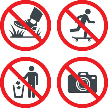 Set of four prohibition warning signs showing no grass walking skating littering or photos