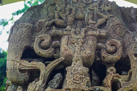 Ancient sculpted gaze abd left side perspective on Maya Stela B of 18 Rabbit 