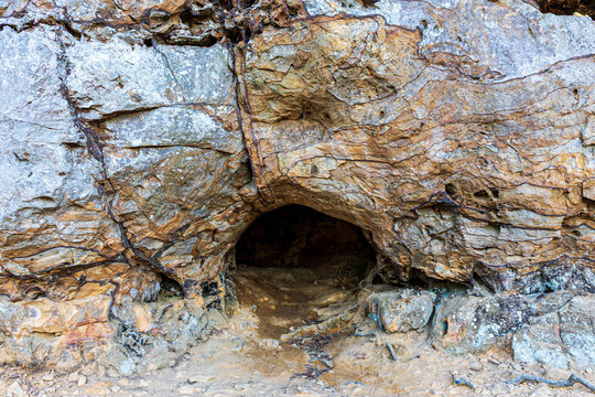 Small rock shelter cave opening on Bear Cave Trail at Petit Jean State Park