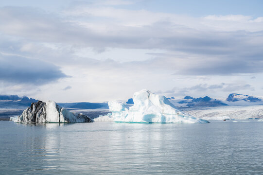 Travel concept. Beautiful landscape with glacier lagoon with view of icebergs floating. Travel landmark,copy space banner