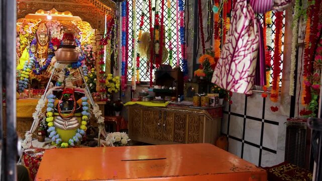 Devotional Shivalingam Worshiped With Flowers and Religious Offerings