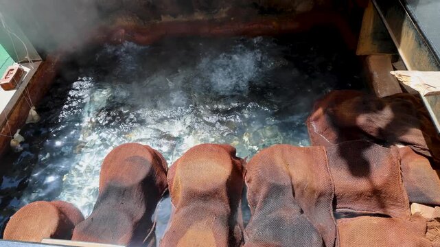 manikaran hot springs producing steam beside religious langar food preparation at Gurudwara Manikaran Sahib