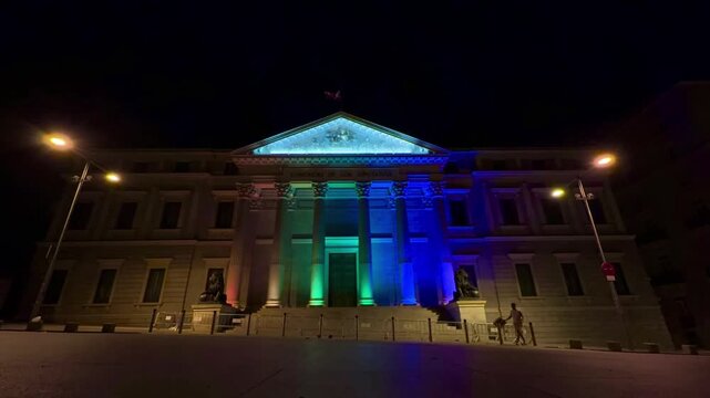 TIMELAPSE | Congreso de los Diputados facade lit in rainbow colors at night for LGBTQ+ Pride, iconic Madrid landmark on Plaza de las Cortes celebrating diversity, equality and inclusion