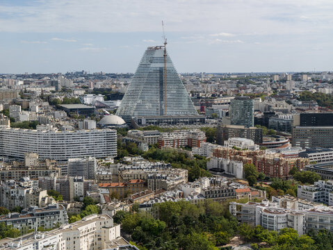 PARIS, FRANCE - SEPTEMBER 1, 2026 - Tour Triangle skyscraper rises above urban Paris buildings under construction