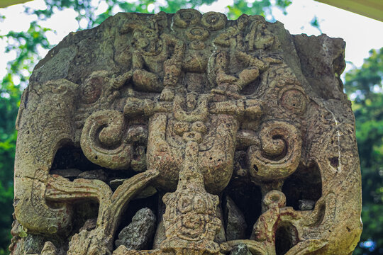 Ancient sculpted gze abd central headdress with macaws on Maya Stela B of 18 Rabbit 