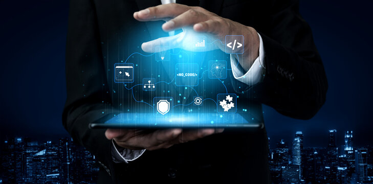 Business Professional Using Tablet to Access Digital Data and AI Technologies in a Modern Urban Environment at Night Quark.