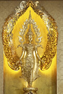 Symbolic depiction of the Buddha as an enlightened, radiant and regal figure in princely regalia, with a flame-shaped ornamental halo (aureole), at the Buddhist temple complex of Wat Phra That Sorn Kaew, Khao Kho Mountains, Phetchabun Province, Isan, Thailand