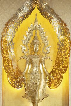 Symbolic depiction of the Buddha as an enlightened, radiant and regal figure in princely regalia, with a flame-shaped ornamental halo (aureole), at the Buddhist temple complex of Wat Phra That Sorn Kaew, Khao Kho Mountains, Phetchabun Province, Isan, Thailand
