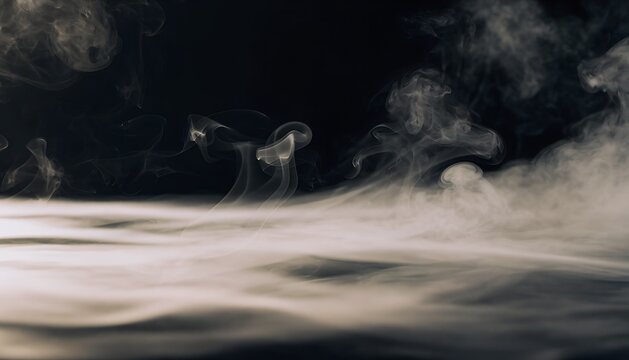 Dense white smoke and fog rolling across the bottom of the frame against a dark background with smoke effect black background smoke texture smoke plume smoke cloud dry ice